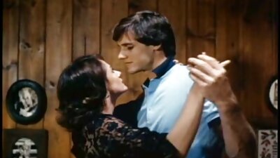 A bimbo with large natural tits spreads her ass open